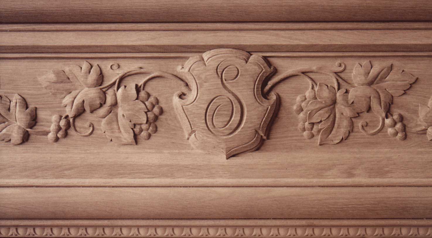 detail shot of S monogram in wood